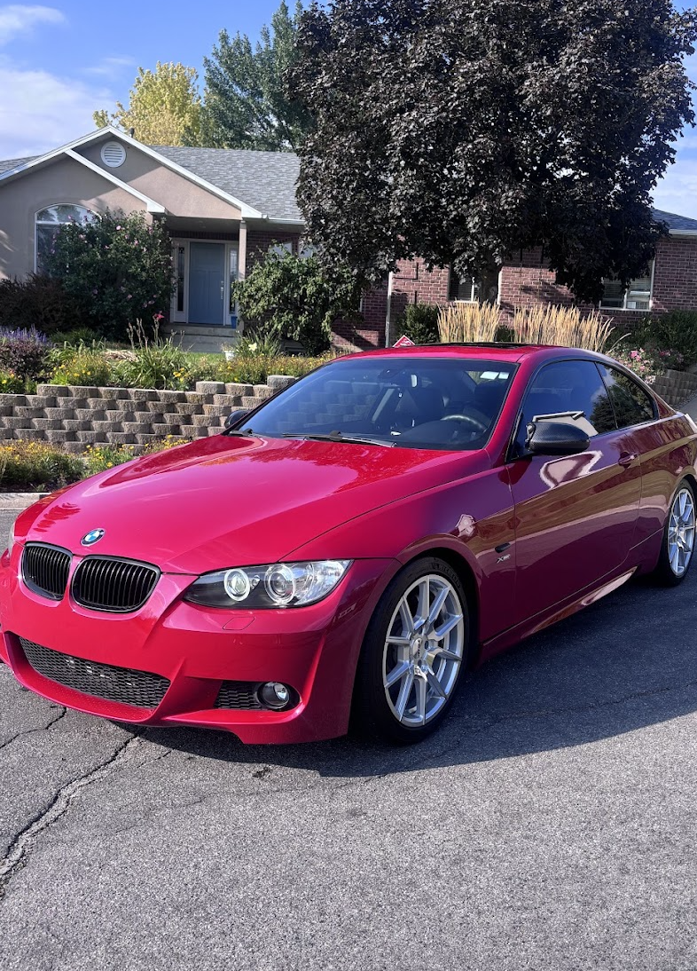 Red coupe with polished paint after mobile exterior detailing