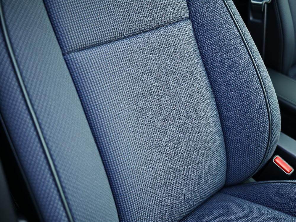 Restored fabric car seat after professional upholstery cleaning